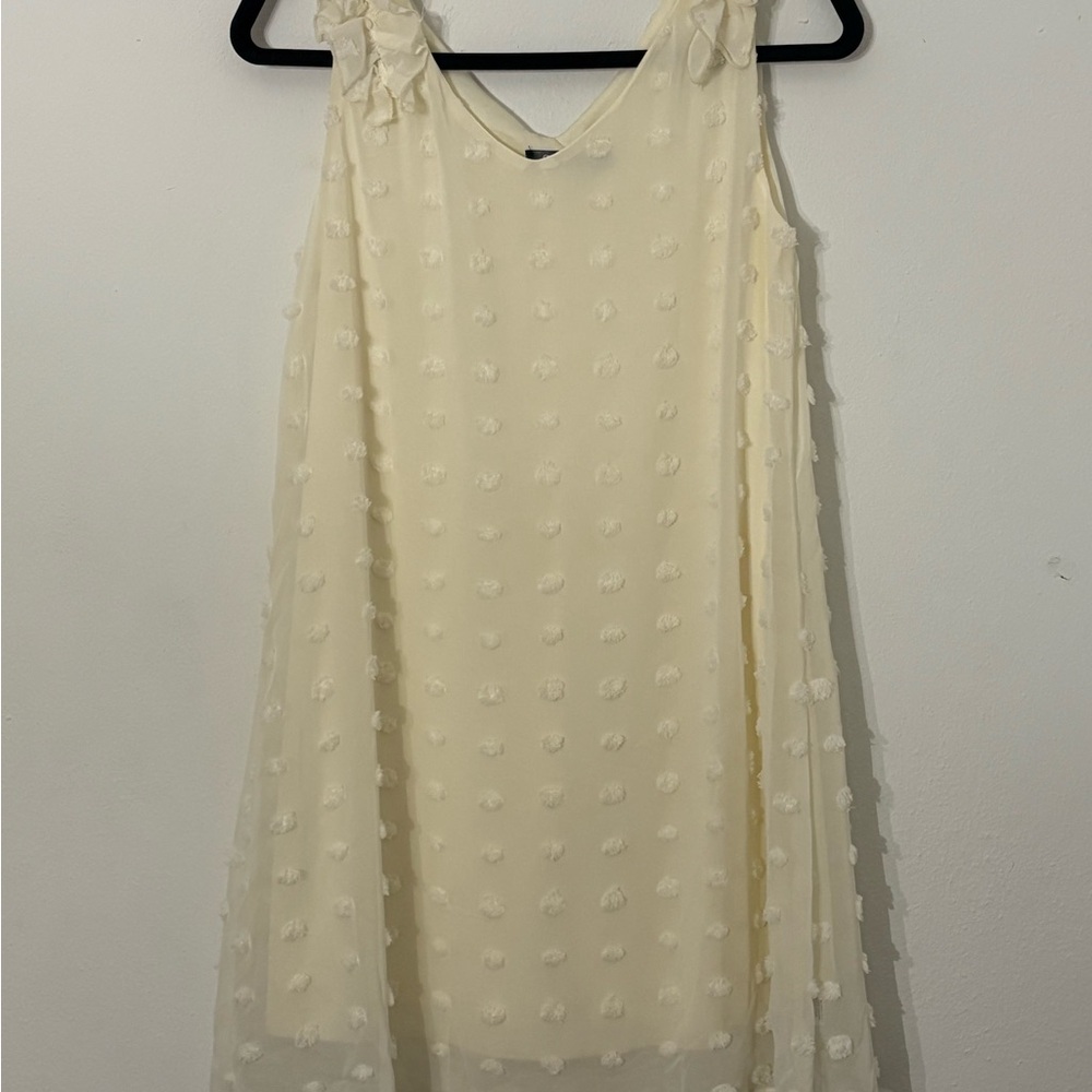 Chic Cream Sleeveless Dress with Textured Detail. Use once